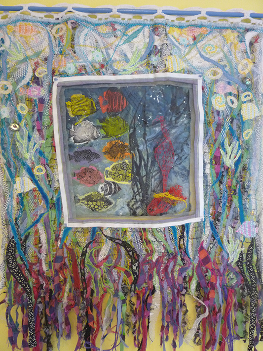 Fish in Ocean, encaustic painting with fabric and thread, 24” x 14”