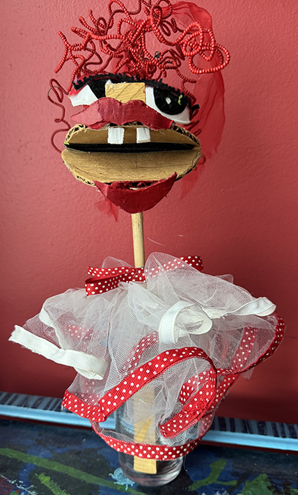 Prima Donna, 16½” high”, wood, tuile, ribbon, cardboard, in our film, “Grandpa’s Dream”